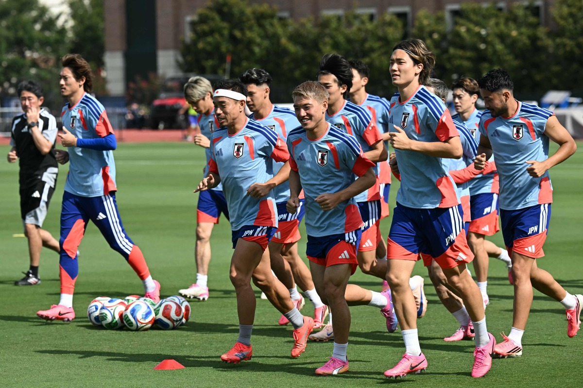 Japan players warm up during a training session. (AFP)