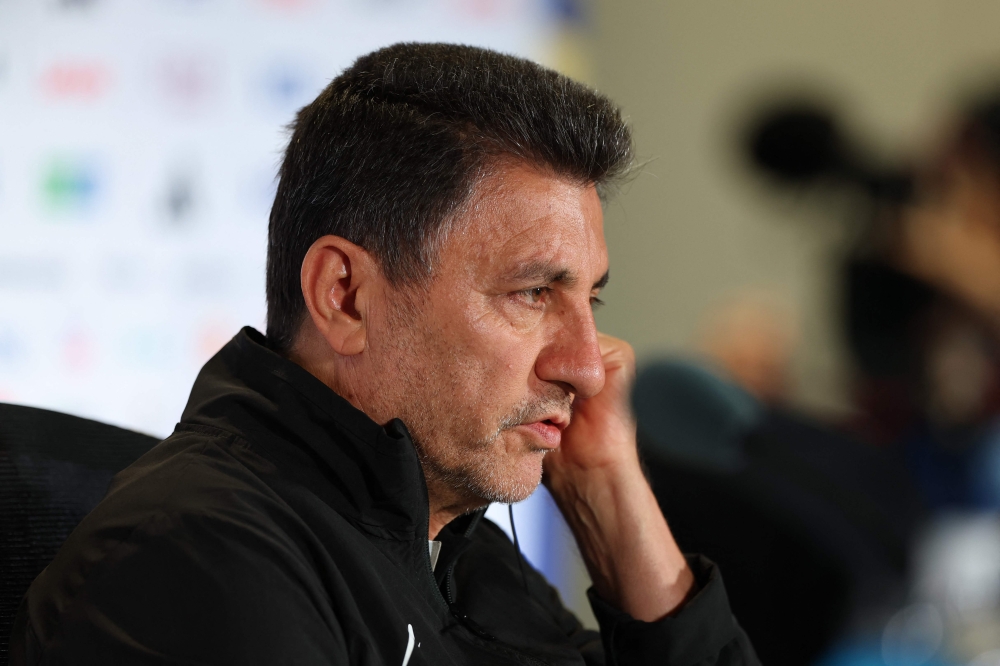 Amir Ghalenoei, head coach of Iran, listens to a question during a press conference one day ahead of the FIFA World Cup 2026 Group G match between Egypt and Iran at Seattle Stadium. Photo by Soobum ImAFP 