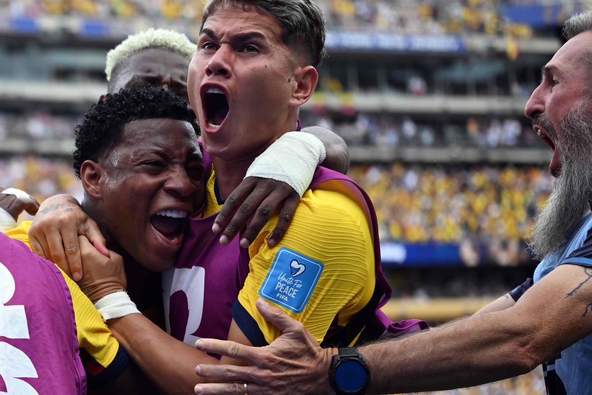 Ecuador's midfielder #19 Gonzalo Plata celebrates with teammates scoring his team's second goal during the 2026 World Cup Group E football match between Ecuador and Germany at the New York/New Jersey Stadium in East Rutherford on June 25, 2026. (Photo by MAURO PIMENTEL / AFP)