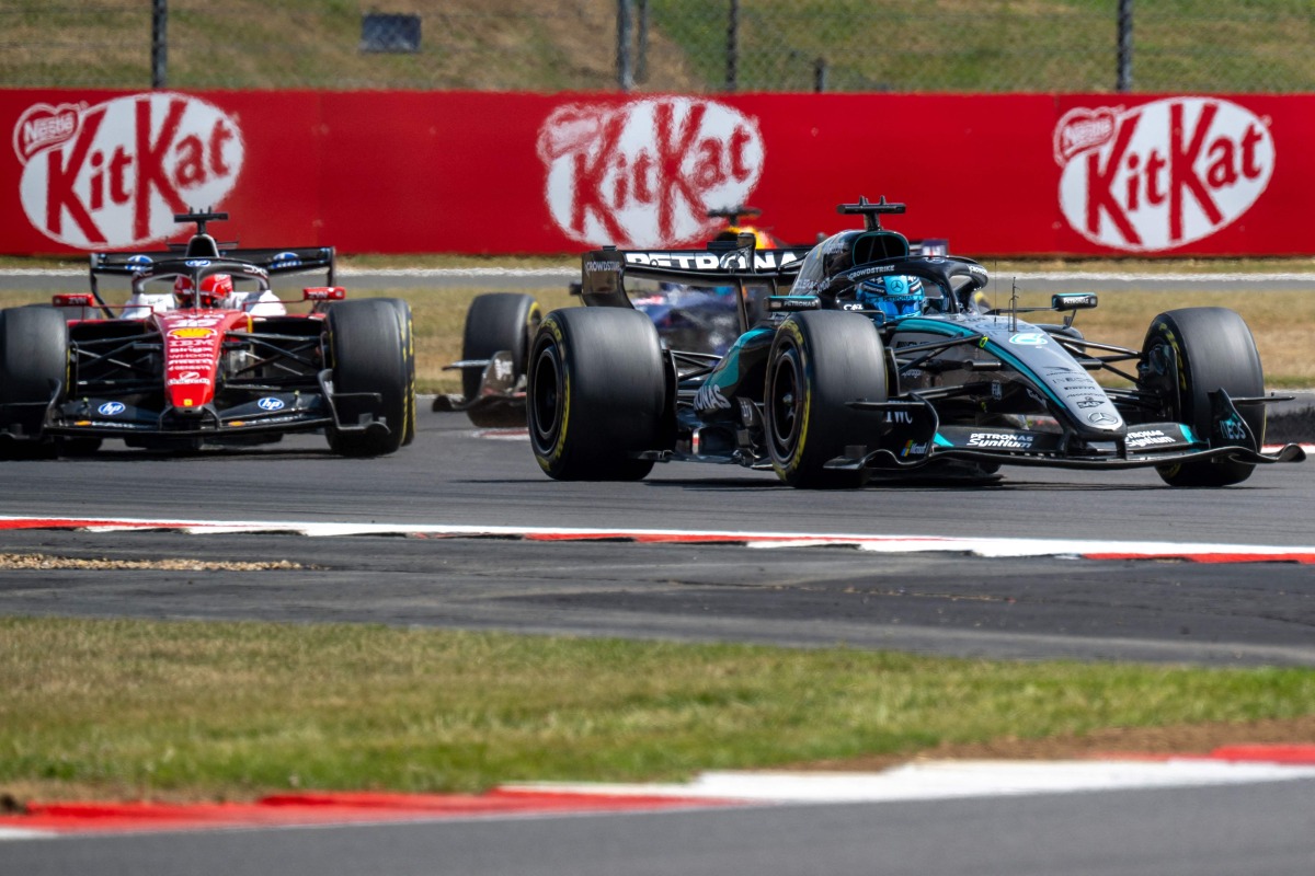 Mercedes' British driver George Russell (R) leads Ferrari's Monegasque driver Charles Leclerc (L) during the sprint race ahead of the Formula One British Grand Prix at the Silverstone motor racing circuit in Silverstone, central England, on July 4, 2026. (Photo by Andrej ISAKOVIC / AFP)