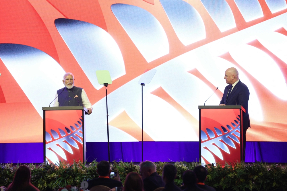 Indian Prime Minister Narendra Modi (L) and New Zealand Prime Minister Christopher Luxon (R) attend the Winning Partnership Celebration in Auckland on July 11, 2026. (Photo by Michael Bradley / AFP)
 