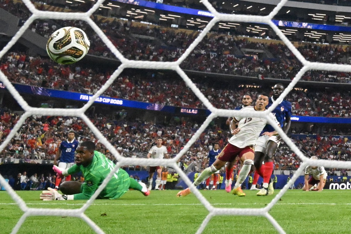 Spain's defender #12 Pedro Porro shoots and scores his team's second goal during the 2026 World Cup football tournament semi-final match between France and Spain at the Dallas Stadium in Arlington on July 14, 2026. (Photo by MAURO PIMENTEL / AFP)