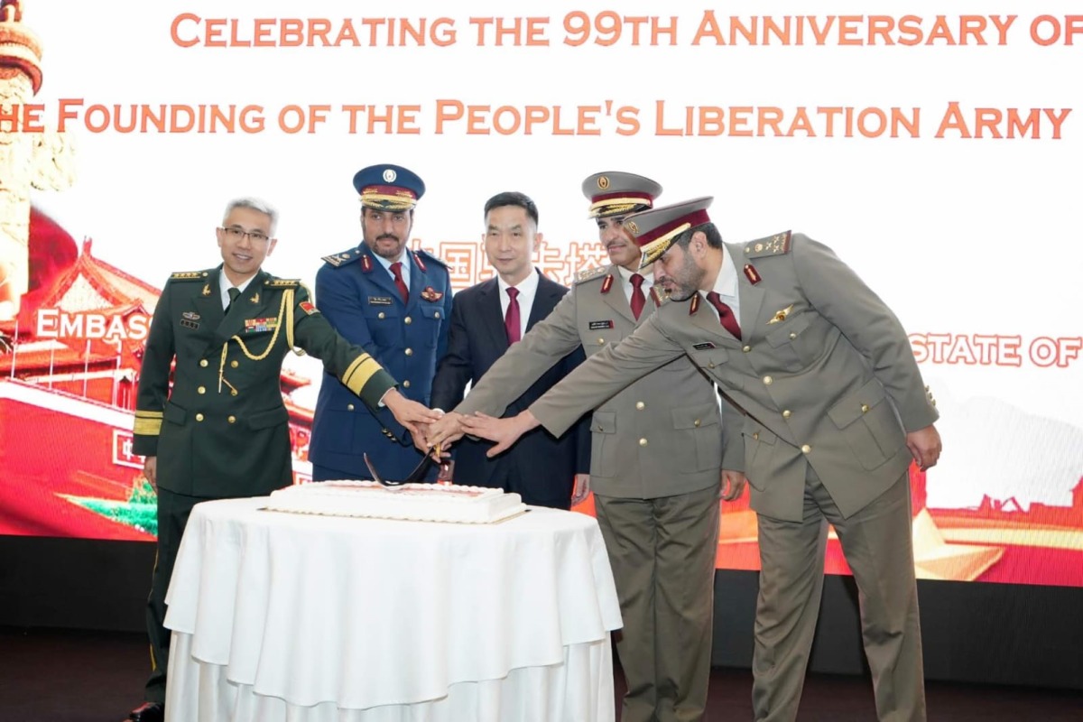 Chinese Ambassador to Qatar H E Cao Xiaolin (centre) and other officials during a cake-cutting ceremony at the reception.