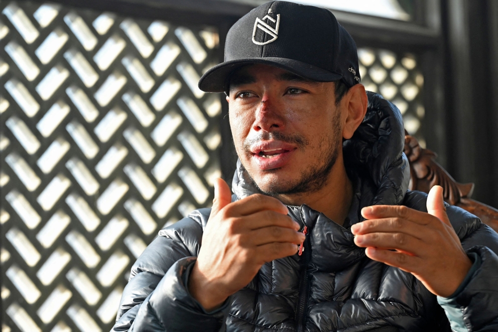 (FILES) In this picture taken on January 21, 2021, Nepali mountaineer Nirmal Purja speaks during an interview with AFP in Skardu, a city district of the Gilgit-Baltistan region in northern Pakistan. Photo by Aamir QURESHI / AFP) 