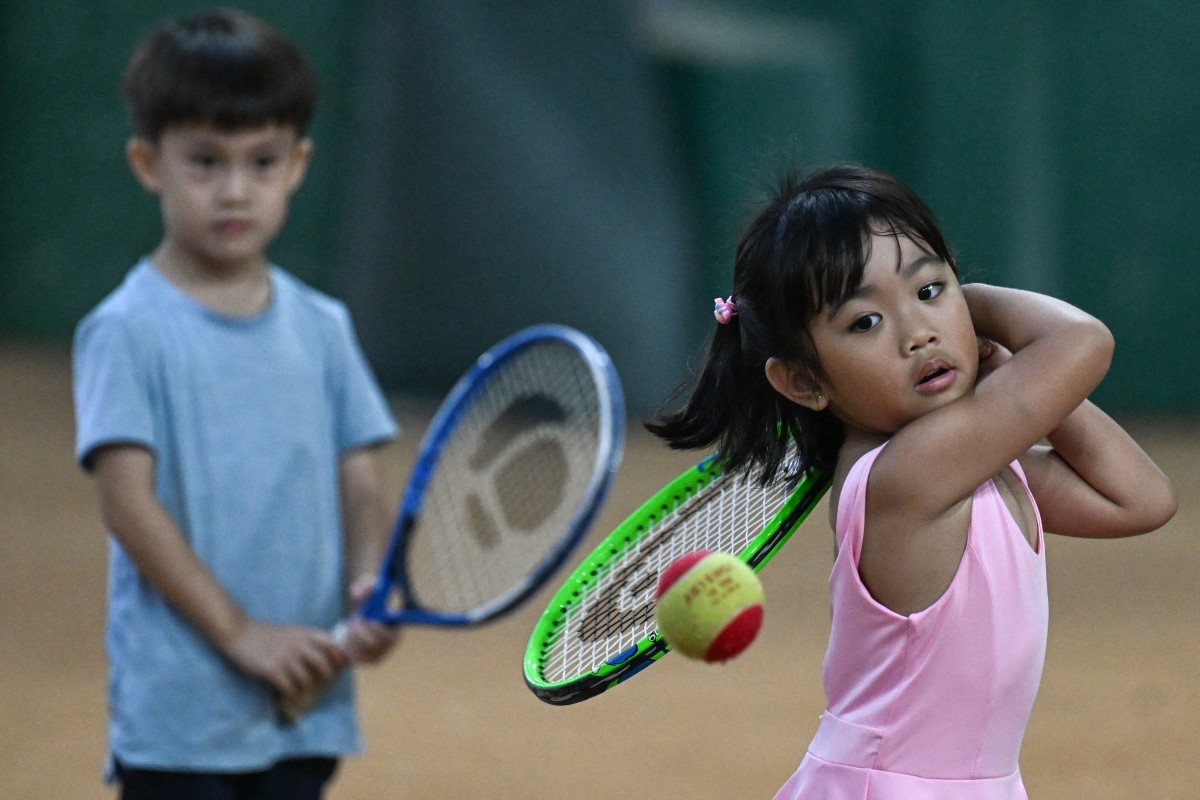 This photo taken on August 7, 2026, shows children taking part in a training session at Alabang Tennis Academy in Muntinlupa, Metro Manila. Photo by JAM STA ROSA / AFP