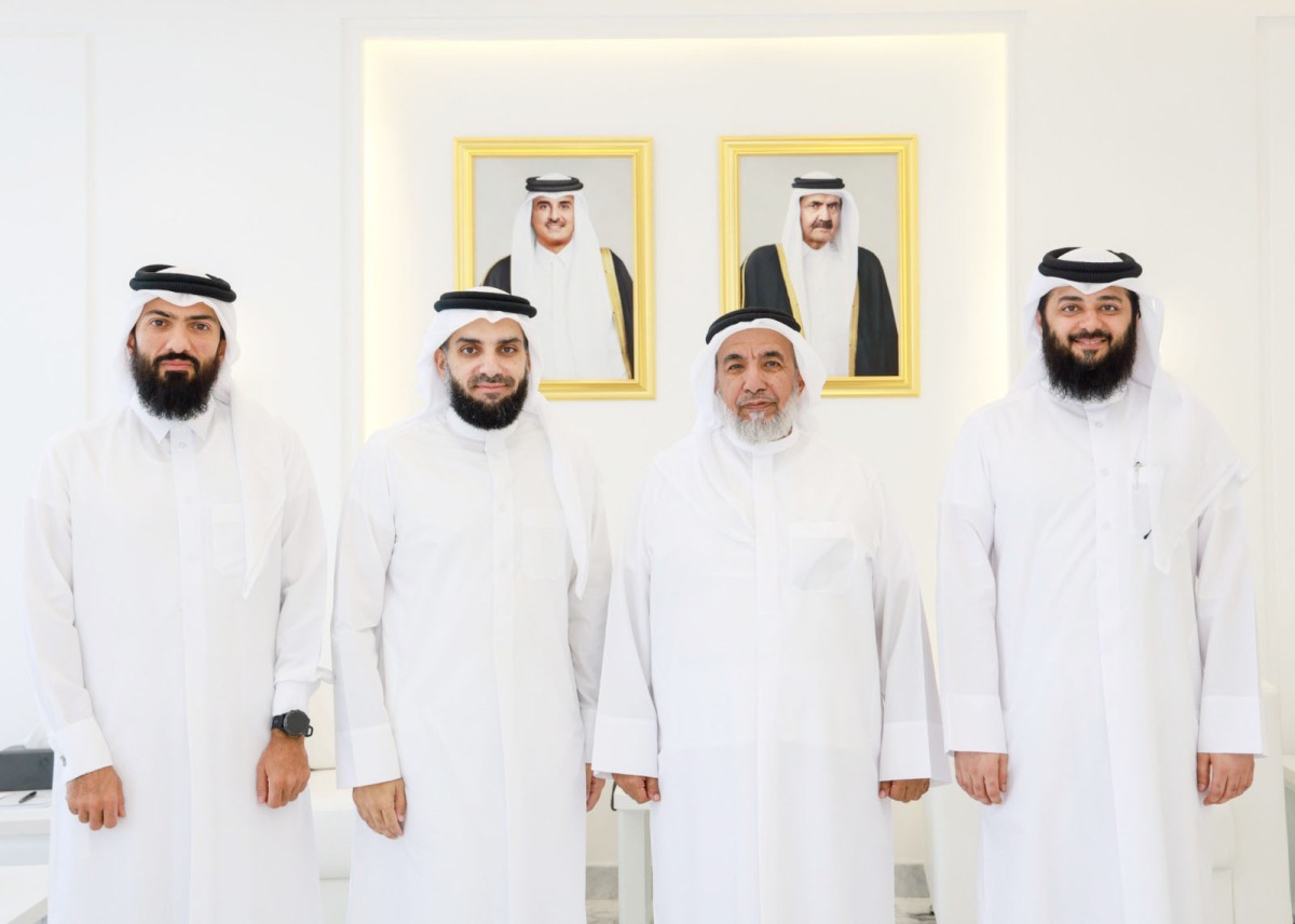 Minister of Awqaf and Islamic Affairs H E Ghanem bin Shaheen bin Ghanem Al Ghanim with other officials and Qatari contestant Yusuf Ahmed Yusuf Hassan Asheer.