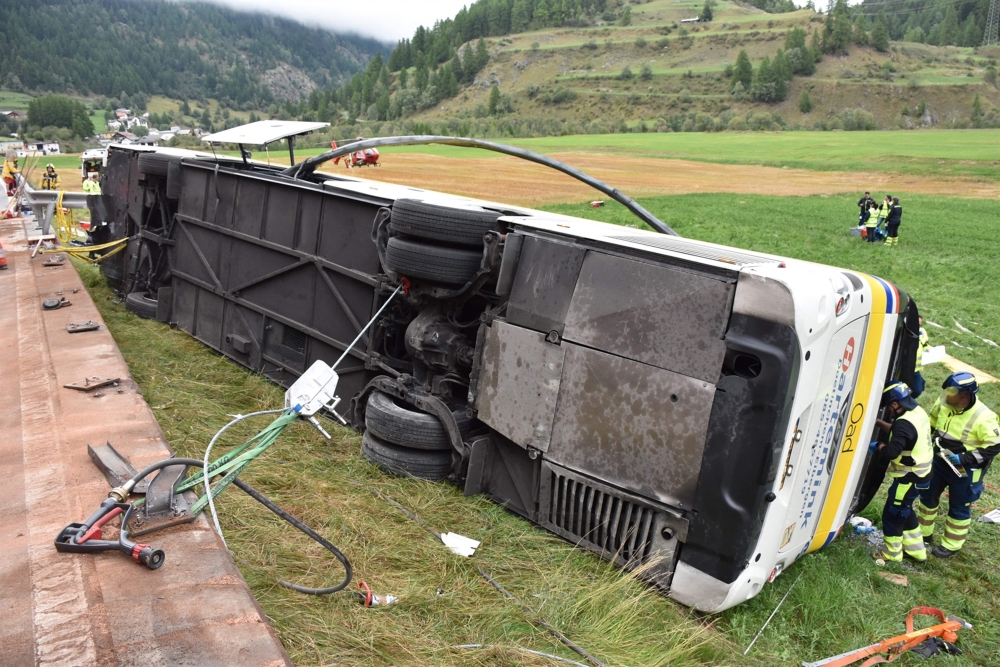 This handout photograph released on September 11, 2026 by the Swiss Police of Canton Graubunden shows the wreckage of a bus after an accident in between the village of Susch and Zernez, eastern Switzerland, on September 10, 2026. (Photo by Handout / KANTONPOLIZEI GRAUBUNDEN / AFP) 