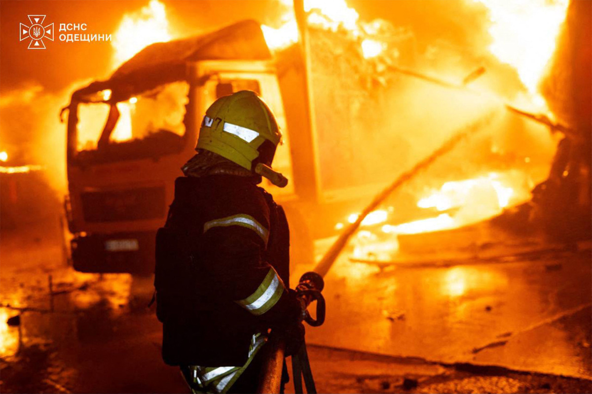This handout picture, taken and released by Ukrainian State Emergency Service, shows a firefighter extinguishing a fire in a production workshop, following a aerial attack in Odesa region, amid the Russian invasion of Ukraine, on September 27, 2026. (Photo by Handout / Ukrainian State Emergency Service / AFP)