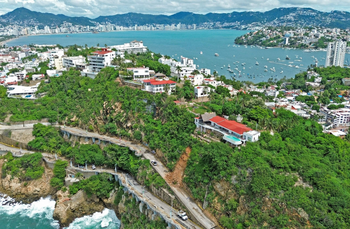 This aerial view shows a landslide caused by heavy rains following the arrival of Hurricane Simon in Acapulco, Guerrero state, Mexico, on October 10, 2026. Photo by Francisco Robles / AFP