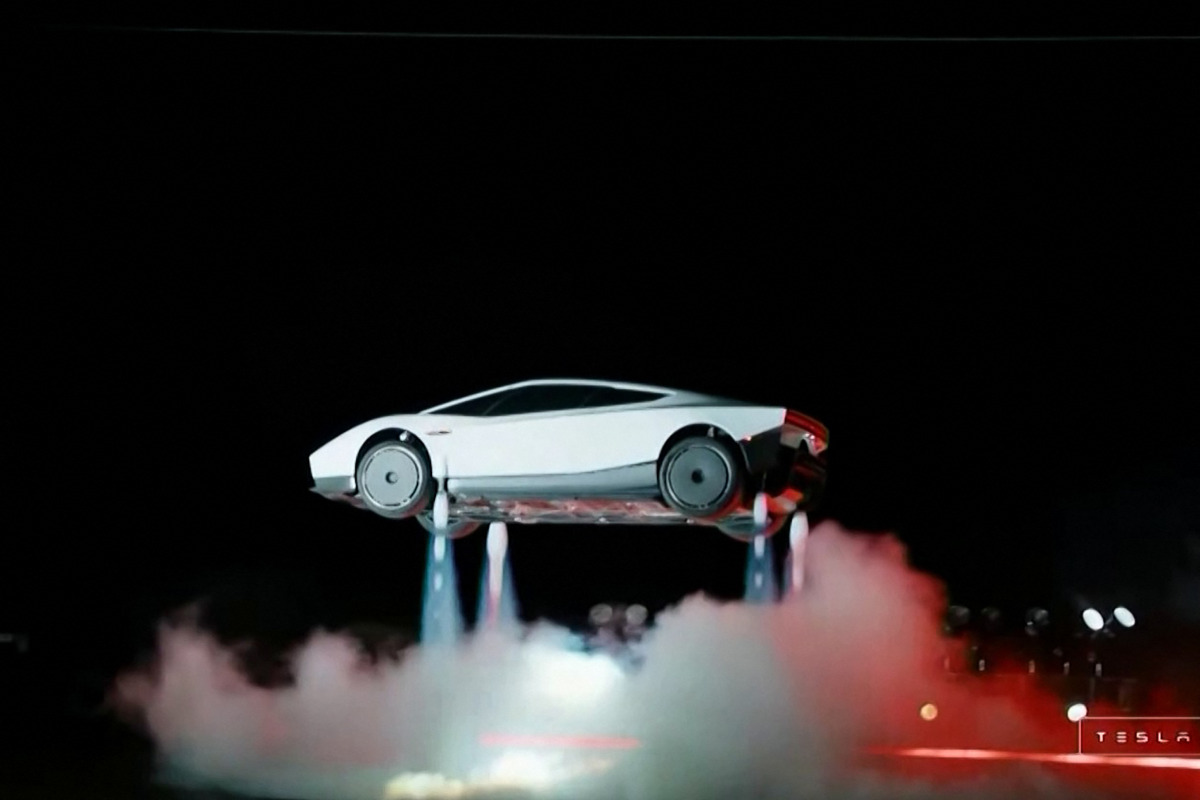 A grab taken on October 16, 2026 from a live feed released by Tesla shows the company unveiling on October 15 its next-generation Roadster electric car in McGregor, Texas, United States. (Photo by Tesla / AFP)