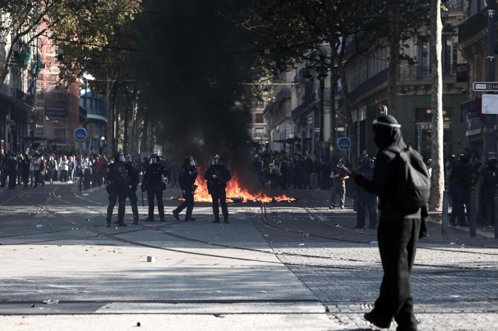 French Republican Security Corps hold protective shield prior to the start of a demonstration to protest against the 'high cost of living', in Marseille on October 17, 2026. (Photo by Thibaud Moritz / AFP)