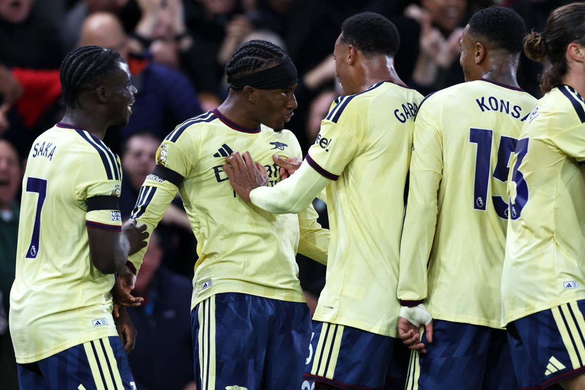 Arsenal's English midfielder #20 Noni Madueke (2L) celebrates scoring the team's first goal with teammates during the English Premier League football match between Nottingham Forest and Arsenal at The City Ground in Nottingham, central England, on October 18, 2026. (Photo by Darren Staples / AFP) 