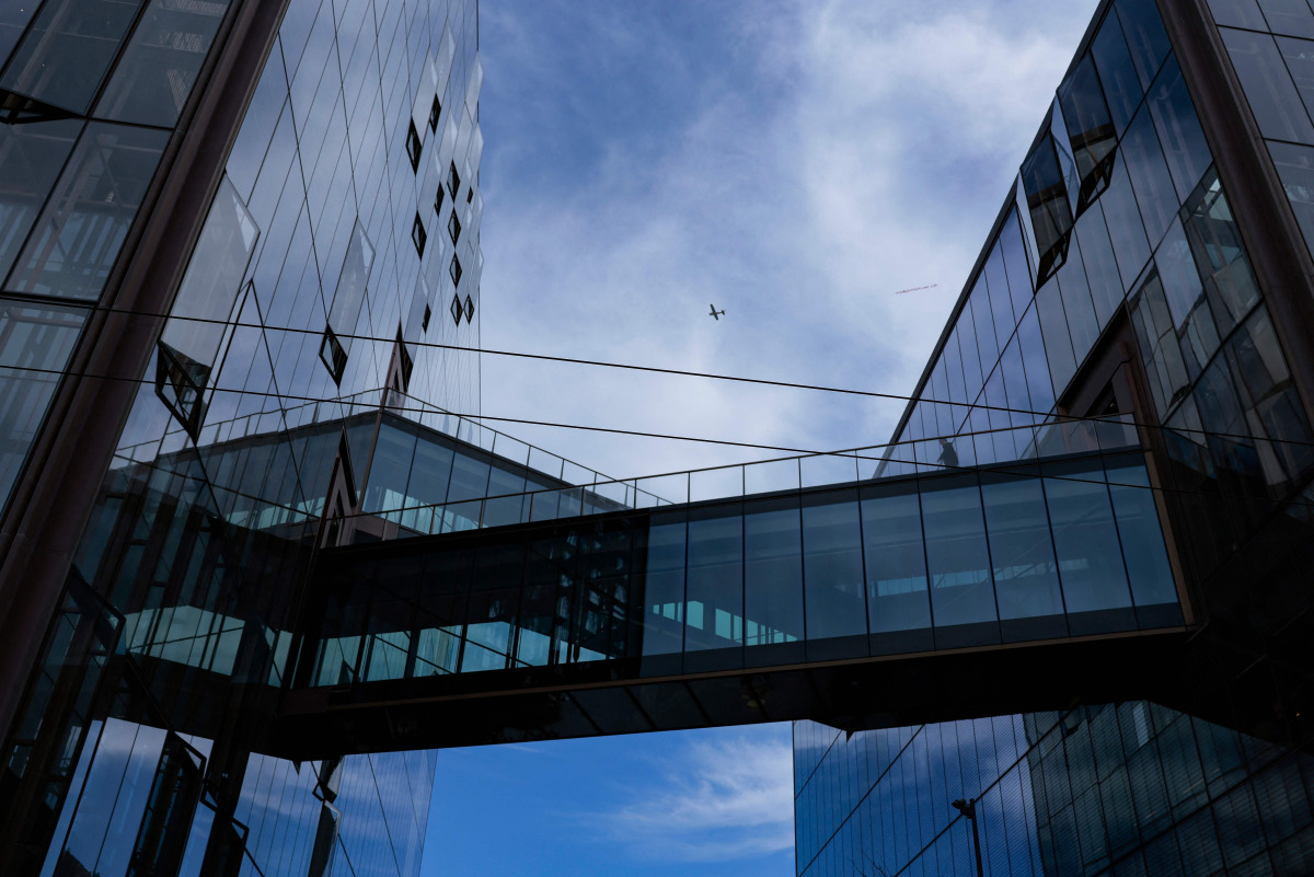 An airplane flies over Open AI headquarters as seen on October 20, 2026 in San Francisco, California. Heather Diehl/Getty Images/AFP