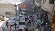 Syrians search for victims at the scene of a reported air strike on the rebel-held northwestern city of Idlib on September 10, 2016.  AFP / Omar haj kadour
