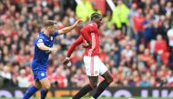 Manchester United's French midfielder Paul Pogba (R) holds off Leicester City's English midfielder Danny Drinkwater (L) during the English Premier League football match between Manchester United and Leicester City at Old Trafford in Manchester, north west