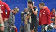 HSV Hamburg v FC Bayern Munich - German Bundesliga - Volksparkstadion, Hamburg, Germany - 24/09/16 Bayern Munich's Mats Hummels is escorted off the pitch after an injury. REUTERS/Fabian Bimmer