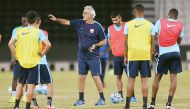 Qatar players train under the watchful eyes of coach Jorge Fossati