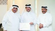 Dr. Abdulaziz Al Meghaiseeb (left), Member of NHRC, honouring one of the participants.