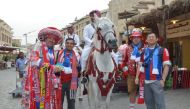 Bayern Munich supporters in Qatar for their team's training camp, visit Doha's Souq Waqif.