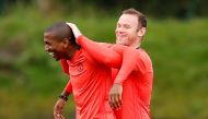 Manchester United's Ashley Young and Wayne Rooney during training. Reuters / Jason Cairnduff