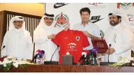 Al Rayyan Sports Club Chairman Sheikh Saoud bin Khalid Al Thani presents a team jersey to their new coach Michael Laudrup during a press briefing held yesterday. Pictures by: Hussein Sayed  