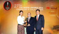 Qatar Airways Senior Vice-President Asia Pacific, Marwan Koleilat (centre), receiving the award on behalf of the airline.