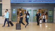 Qatari football players arrive at the Seoul International Airport yesterday, ahead of their 2018 FIFA World Cup qualifying match against South Korea which will be played at the Suwon World Cup Stadium in Gyeonggi-do tomorrow. 