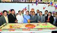 Philippine Ambassador to Qatar Wilfredo C Santos (fourth left) cuts a ceremonial cake to mark the opening of Pinoy Fiesta 2016 at the Lulu Hypermarket, D-Ring Road, in the presence of Mohamed Althaf (third right) Regional Director, Lulu Group, Qatar and o