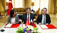 Turkish Ambassador Ahmet Demirok (centre), VFS Global Regional Head-Middle East Yummi Talwar (left) and Kingston Global Group CEO Dr. Afshin Hurmuzlu during the signing ceremony at the ambassador’s residence yesterday. Pic: Qassim Rahmatullah/The Peninsul