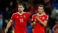 Wales' Gareth Bale and Sam Vokes look dejected after the match. Reuters / Andrew Couldridge
