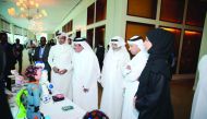 Minister of Transport and Communications H E Jassim bin Saif Al Sulaiti and other officials touring stalls after the opening of the Second National Autism Forum yesterday.