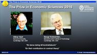 Winners of the Nobel Prize in Economic Sciences British-American economist Oliver Hart (L) and Bengt Holmstrom of Finland are displayed on a screen during a press conference to announce the winner of the 2016 Nobel Prize in Economic Sciences at the Royal 
