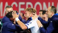 Italy's forward Ciro Immobile (C) celebrates with his teammates after scoring a goal during the FIFA World Cup 2018 qualifying football match between Macedonia and Italy on October 9, 2016 at Philip II of Macedon stadium in Skopje. / AFP / Robert ATANASOV