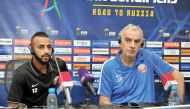Qatar coach Jorge Fossati (right) and forward Magid Mohammed listen to a question asked by a journalist during a press briefing held yesterday, ahead of their 2018 FIFA World Cup qualifier against Syria which will be played at Al Sadd Stadium in Doha toda