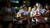 Well-wishers pray for Thailand's King Bhumibol Adulyadej at the Siriraj hospital where he is residing in Bangkok, Thailand October 12, 2016. REUTERS/Athit Perawongmetha