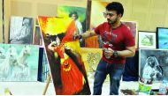 An artist at work during the painting workshop organised by Visual Artists Forum India at the Birla Public School yesterday. Pic: Kammutty V P / The Peninsula