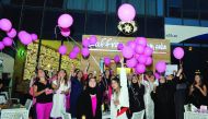 Participants release pink balloons during the ‘Pink High-Tea’ Breast Cancer Awareness Campaign held in the presence of Aliazi Al Kuwari, CEO of Gulf Society of Special Needs, at Zaffran Dining Experience yesterday. The event was organised by iQatar and su