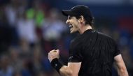 Andy Murray of Britain celebrates after winning his men's singles finals match against Roberto Bautista Agut of Spain at the Shanghai Masters tennis tournament in Shanghai on October 16, 2016. / AFP / JOHANNES EISELE
