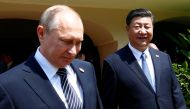Russian President Vladimir Putin (L) and Chinese President Xi Jinping arrive for a group picture during BRICS (Brazil, Russia, India, China and South Africa) Summit in Benaulim, in the western state of Goa, India, October 16, 2016. REUTERS/Danish Siddiqui