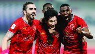 Players of Lekhwiya celebrate a goal during the Qatar Stars League (QSL) match against Al Sadd at Lekhwiya Stadium in Doha yesterday. The match ended in a thrilling three-all draw. 
