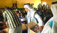 Students distributing gifts to schoolchildren in Kenya.