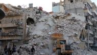Syrians inspect the debris of collapsed buildings after airstrike over residential areas at opposition controlled Merce neighborhood in Aleppo, Syria on October 17, 2016. (?brahim Ebu Leys - Anadolu Agency)