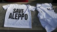 T-shirts are laid out during a demonstration urging the British government to intervene in the bombing of Aleppo, outside Downing Street, London, Britain October 22, 2016. REUTERS/Peter Nicholls