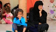 Displaced people who recently fled the Islamic State's stronghold on the outskirts of Mosul wait to be transferred to a tent, at Debaga camp on the outskirts of Erbil, Iraq October 23, 2016. (REUTERS/Thaier Al-Sudaini)