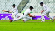 England’s captain Alastair Cook takes a catch to dismiss Bangaldesh’s captain Mohammad Rahim (left) during their second Test match which started at Sher-e-Bangla Stadium in Dhaka, Bangladesh yesterday.