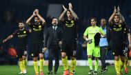 Manchester City's Spanish manager Pep Guardiola (C) celebrates on the pitch with his players after the English Premier League football match between West Bromwich Albion and Manchester City at The Hawthorns stadium in West Bromwich, central England, on Oc