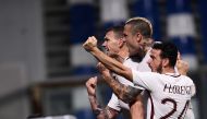 TOPSHOT - Roma's forward from Bosnia-Herzegovina Edin Dzeko (L) celebrates with Roma's midfielder from Belgium Radja Nainggolan and Roma's midfielder from Italy Alessandro Florenzi (R) after scoring a penalty during the Italian Serie A football match Sass