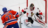 Ottawa Senators goaltender Craig Anderson (41) makes a save on Edmonton Oilers forward Milan Lucic (27) during the first period at Rogers Place. Mandatory Credit: Perry Nelson-USA TODAY Sports