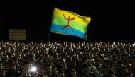 © AFP/File | Protesters hold the Amazigh (Berber) flag during a demonstration in the northern Moroccan city of Al Hoceima on October 30, 2016, following the death of fish seller Mouhcine Fikri