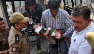 Indian volunteers and officials carry a two and a half year-old child Pari into The Government Medical College Hospital in Jammu on November 1, 2016, after he was injured in cross-border shelling in the disputed Himalayan region of Kashmir. Indian authori